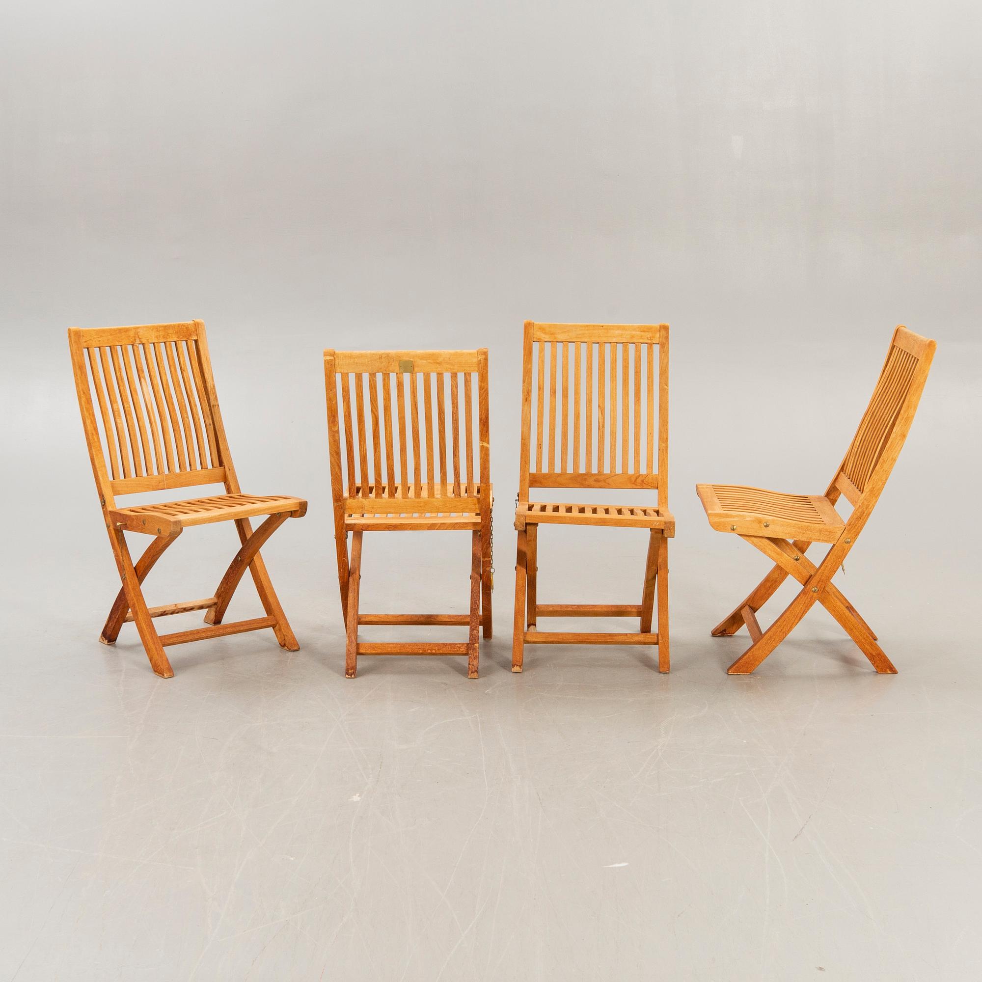 A set of four chairs and a table Royal teak and others, later part of the 20th century.