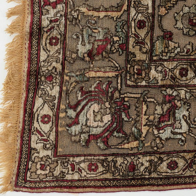 A rug, an antique silk metal brocaded Kashan, probably around 1910, ca 200-202,5 x 129-131 cm.