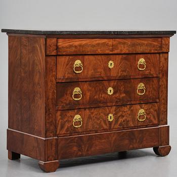 A French Empire mahogany commode, early 19th century.