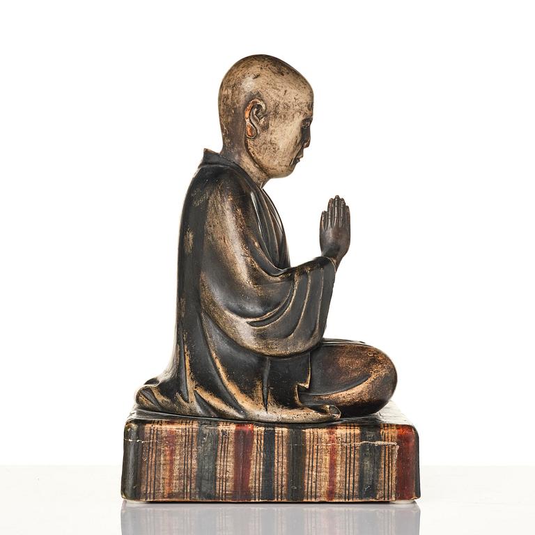 A painted and lacquered wooden sculpture of a monk, Japan, 19th century.