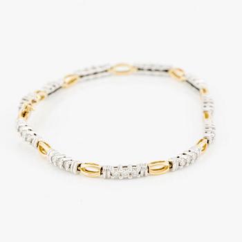 Armlänk, 14K guld med briljantslipade diamanter.