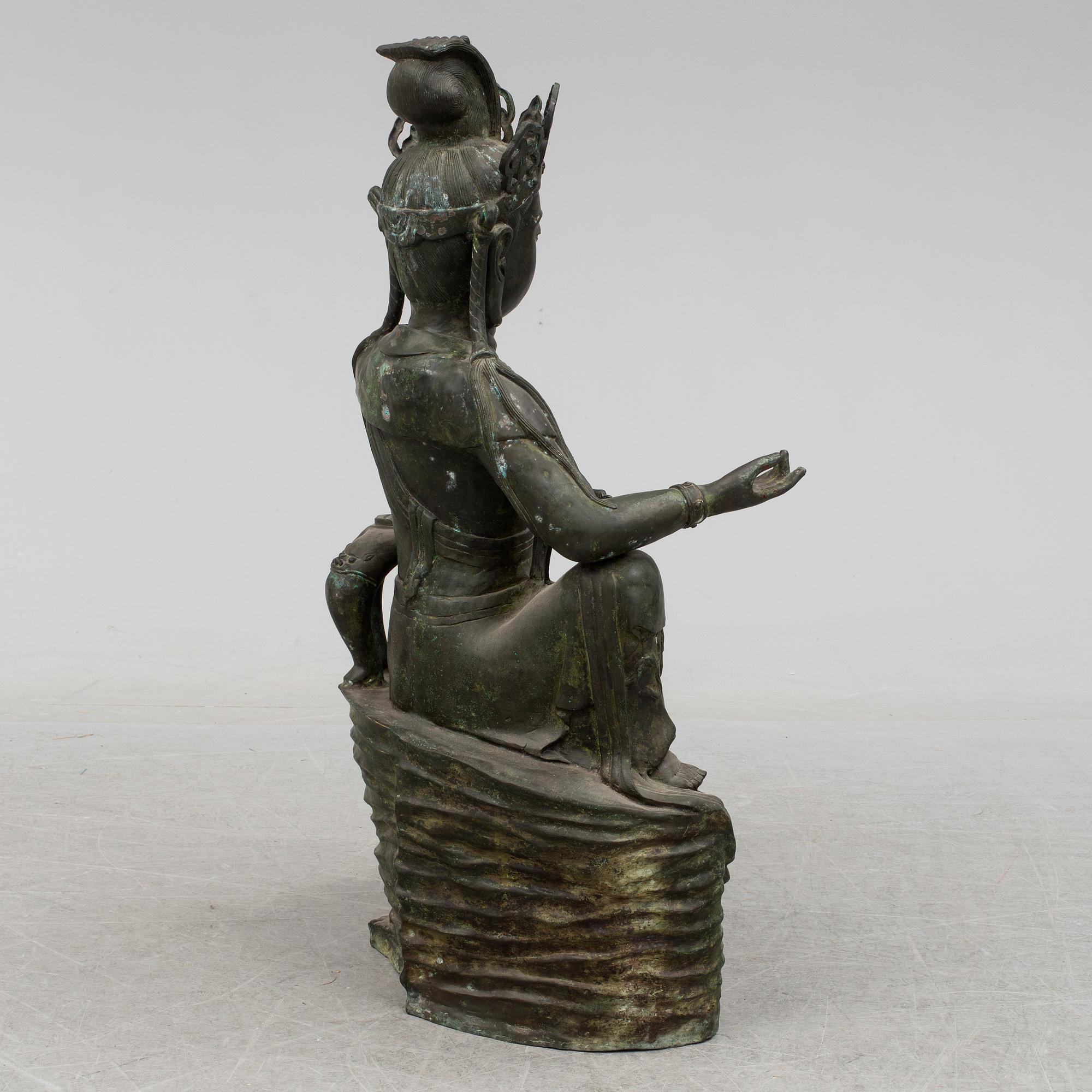 A mid 20th century metal Guan Yin figurine, China.