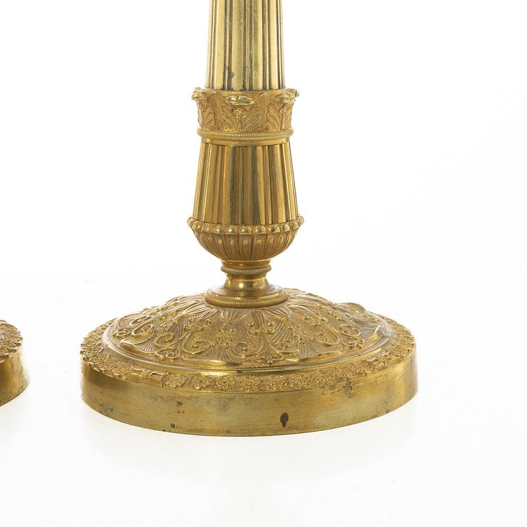 A pair of French Empire candlesticks, early 19th century.