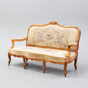 A set of sofa, two armchairs and six chairs, Louis XV-style, ca 1900.