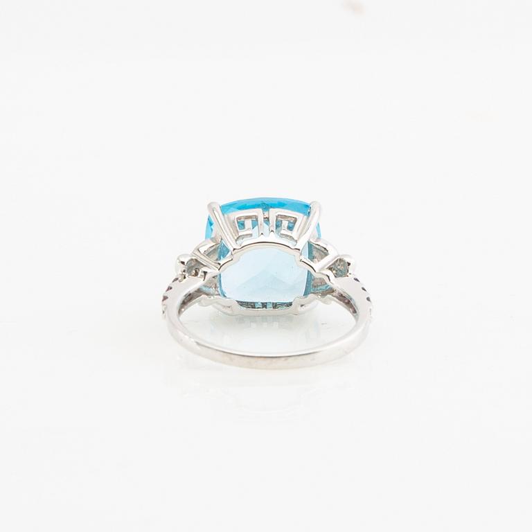 Ring, 14K gold with topaz, diamonds, and purple garnets.