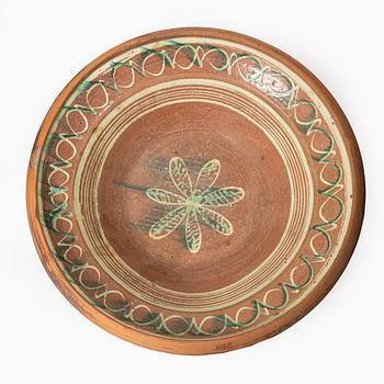 One eathenware bowl and two plates.