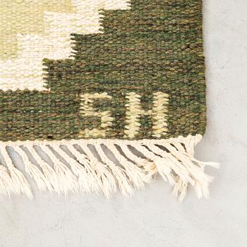 Flat-weave rug signed SH, approximately 194x133 cm.