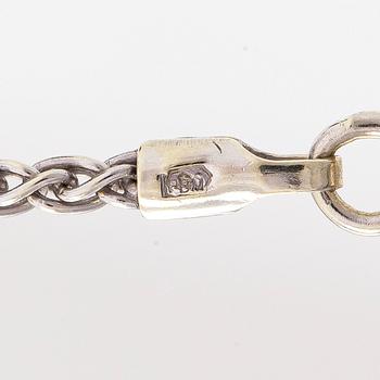 Necklace/pendant, cross, 14K white gold with diamonds totalling approx. 0.25 ct. Finnish hallmarks.