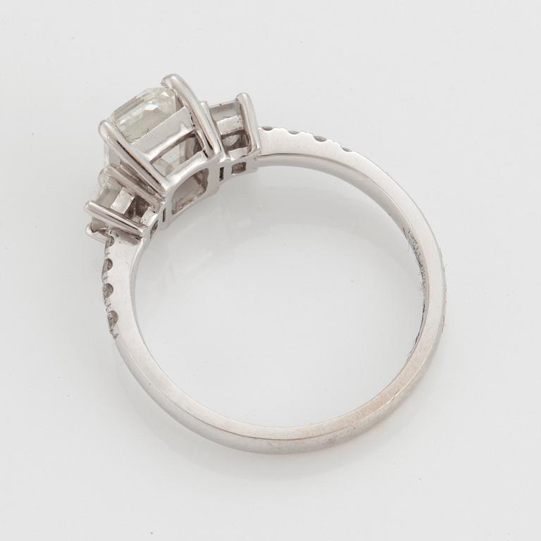 A RING set with an emerald-cut diamond.