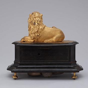 A rare gilt brass on ebonised base Lion Automaton figure clock, Augsburg circa 1630.