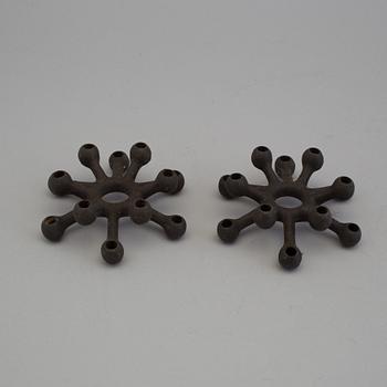 4 different candlesticks, including Ystad Metall, "Nagel" by Werner Stoff.