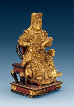 A wooden gilt lacquer figure of a warrior diety, Qing dynasty, 18/19th Century.