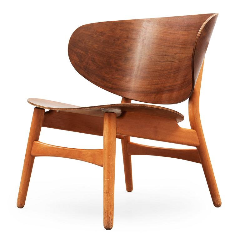 A Hans J Wegner mahogany and beech easy chair, Denmark 1950's.