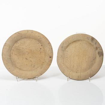 Twelve wooden plates, 19th Century.
