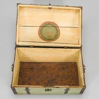 A wooden storage chest dated year 1777.