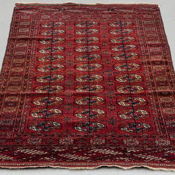 A RUG, semi-antique/old Tekke, ca 199 x 122,5 (as well as 5 flat weave at both of the ends).