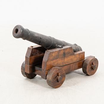 Ship's cannon with lavette 20th century or older cast iron and wood.