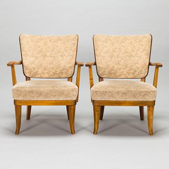 Einari Kyöstilä, a pair of 1940s open armchairs for Oy Stockmann Ab, Keravan Puusepäntehdas, Finland.