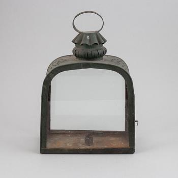 An 18th century tinplate and glass lantern.