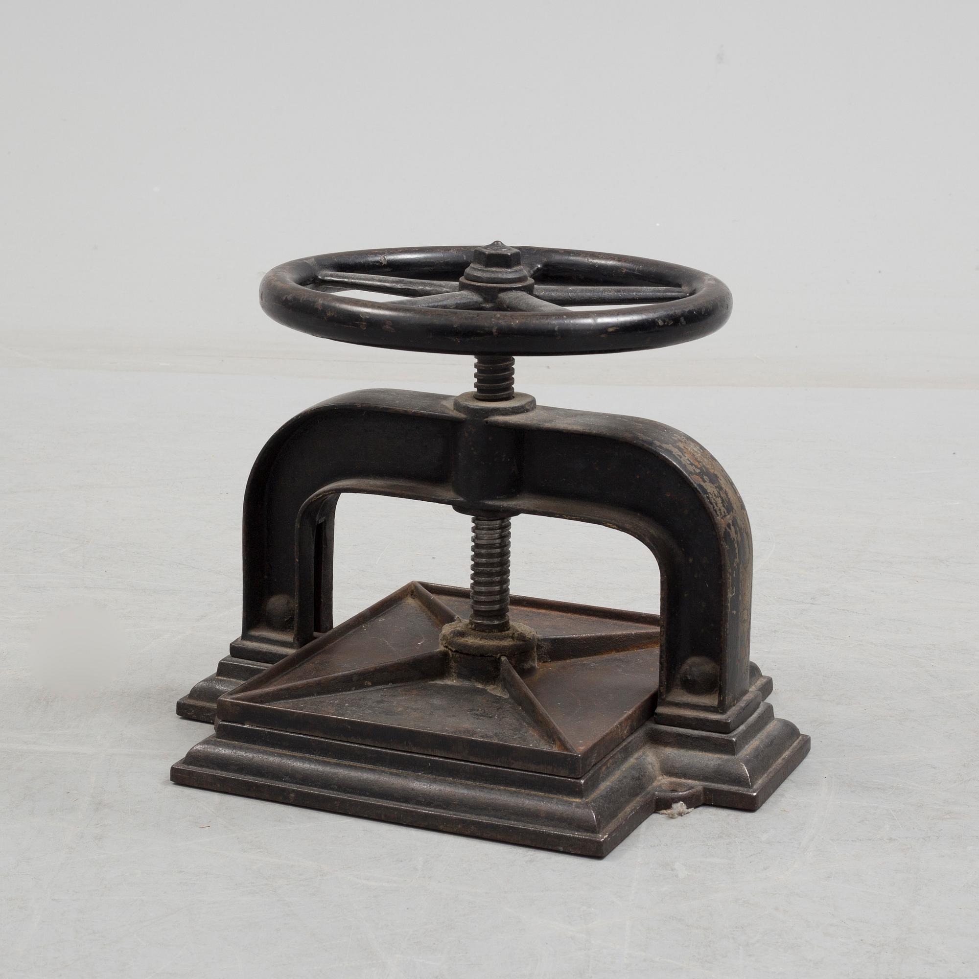 A cast iron book press from around year 1900.