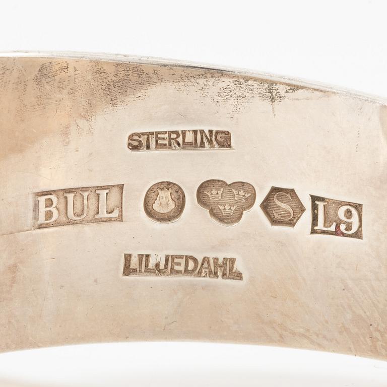 Bengt Liljedahl, arm ring, silver with light yellow stone.