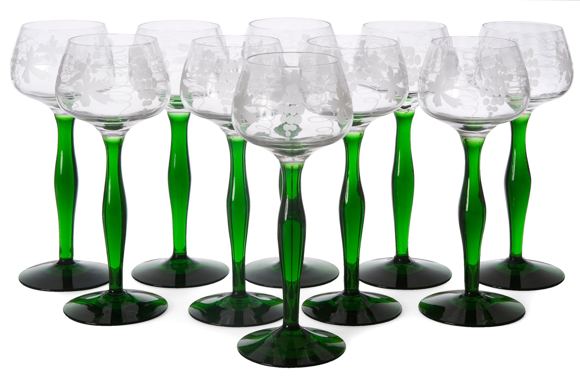 A SET OF TEN WHITE WINE GLASSES.