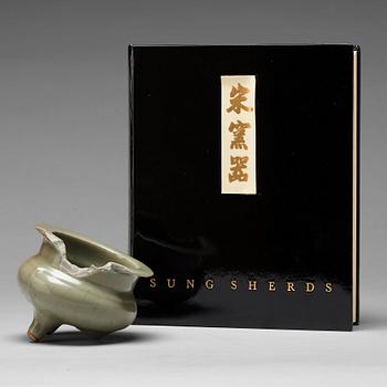 772. A book about Sung Sherds and a tripod censer depicted in the book, Song/Yuan dynasty.