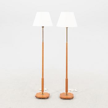 A pair of 1960s teak floor lamps.