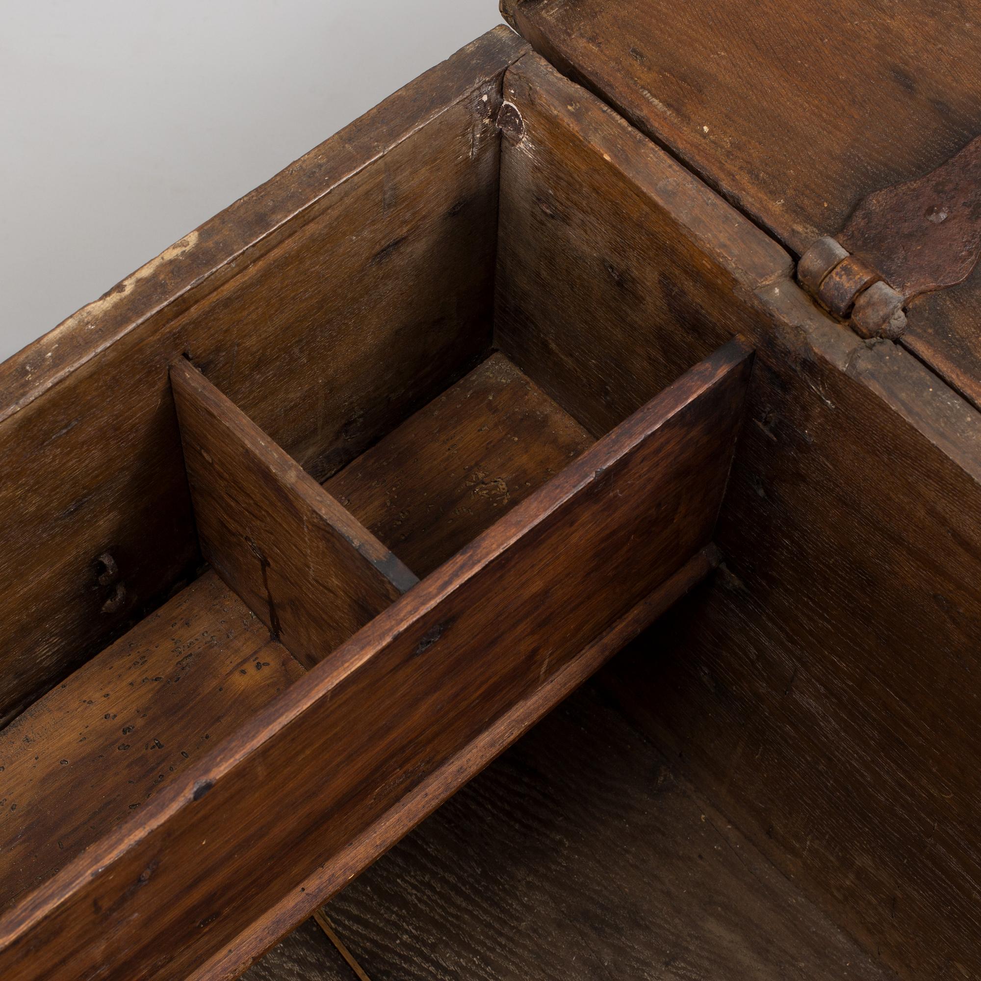 A large 17/17th century baroque oak chest with wrought iron fittings.