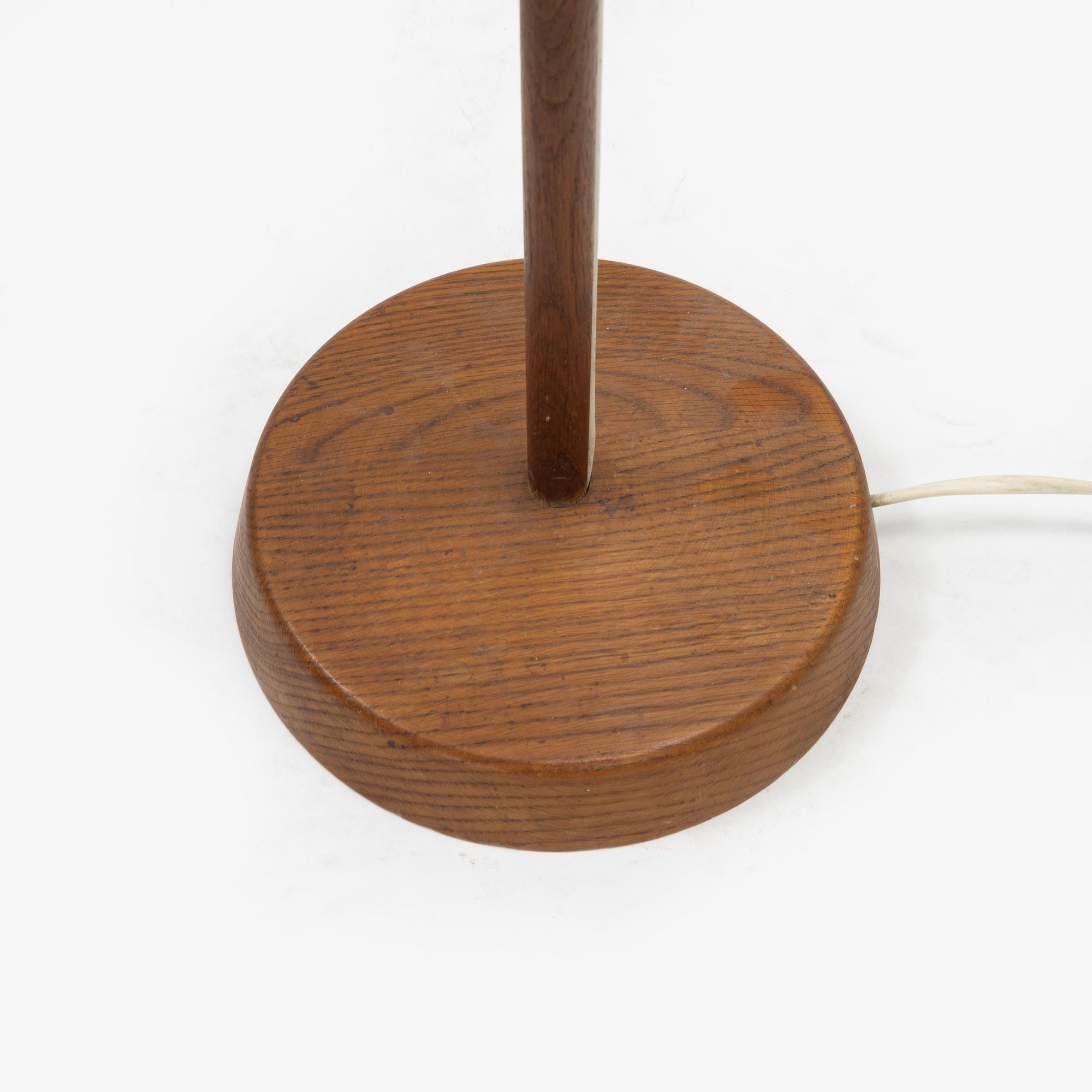Uno & Östen Kristiansson, an oak floor light, Luxus, Vittsjö, Sweden, mid 20th Century.