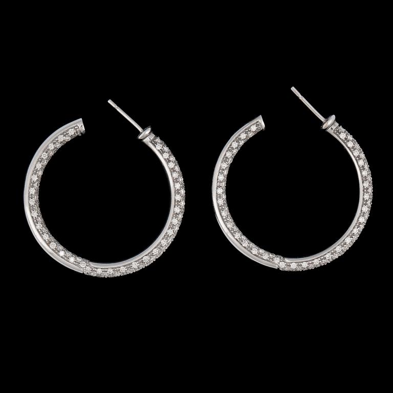 A pair of brilliant cut diamond earrings, tot. app. 3 cts.