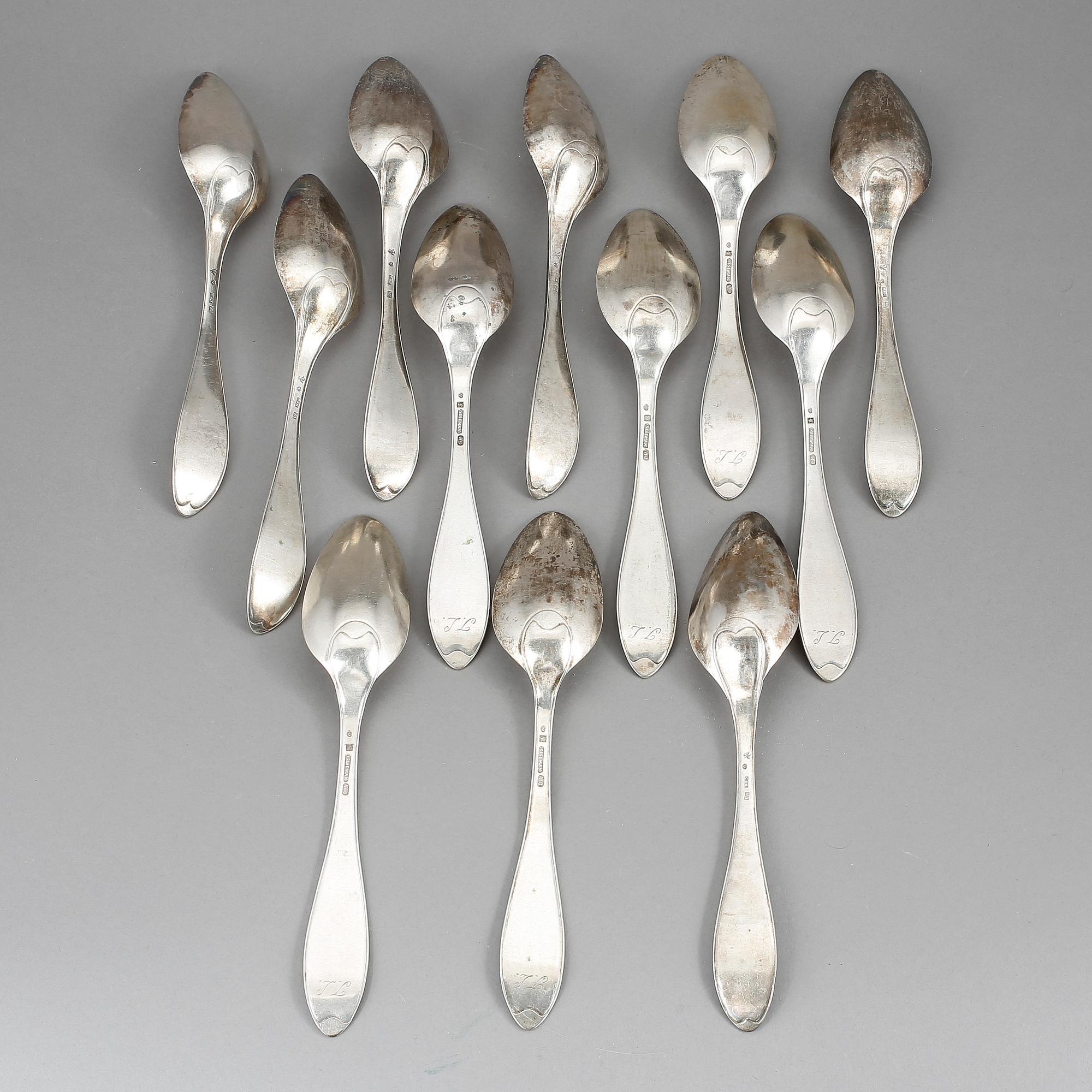 MATSKEDAR, 12 st, silver. Modell svensk spets. Bla Sesseman, Arboga, 1800-talets början. Total vikt ca 758 g.