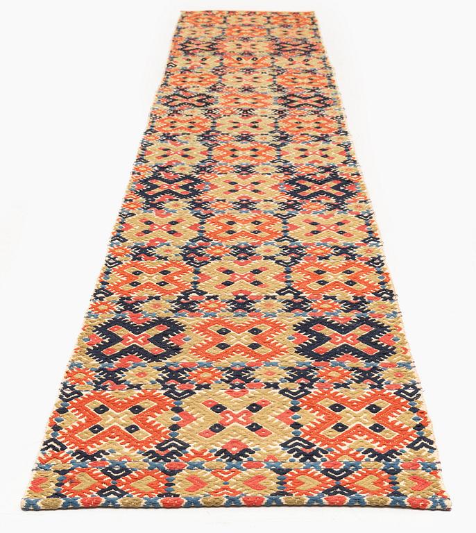 A bench cushion, flat weave, c. 344 x 51 cm, Herrestads district, Scania, Sweden, first half of the 19th century.