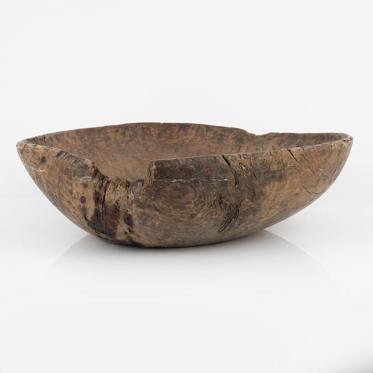 A wood bowl, dated 1765.