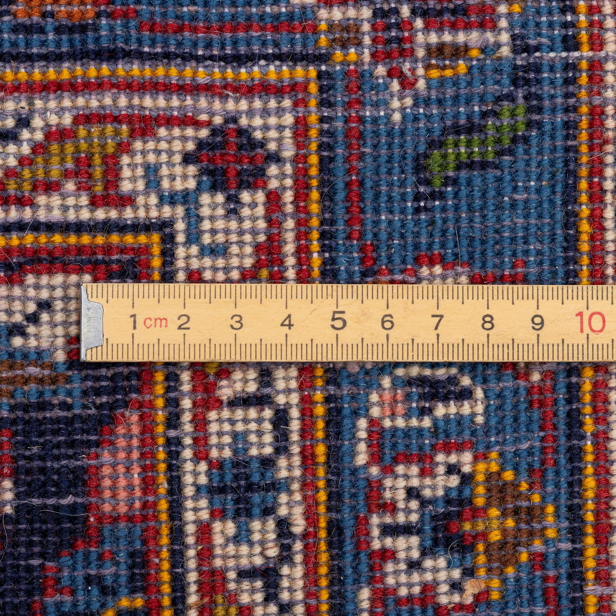 An oriental carpet, c. 340 x 240 cm.