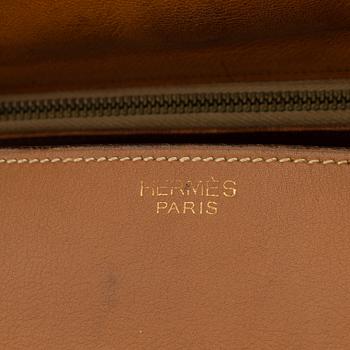 Hermès, a vintage tan leather bag, mid 20th century.