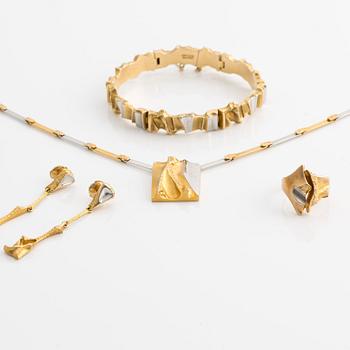A Lapponia jewelry set including a necklace, a bracelet, a pair of earrings, and a ring, designed by Björn Weckström.