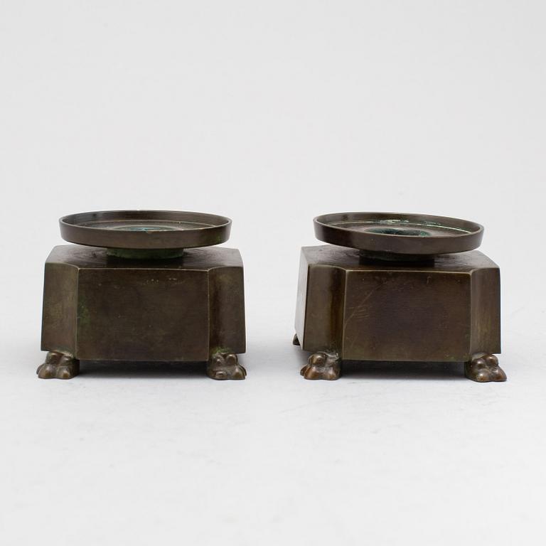 GULDSMEDSAKTIEBOLAGET (GAB), a pair of bronze candlesticks, Stockholm 1930's, model 204.