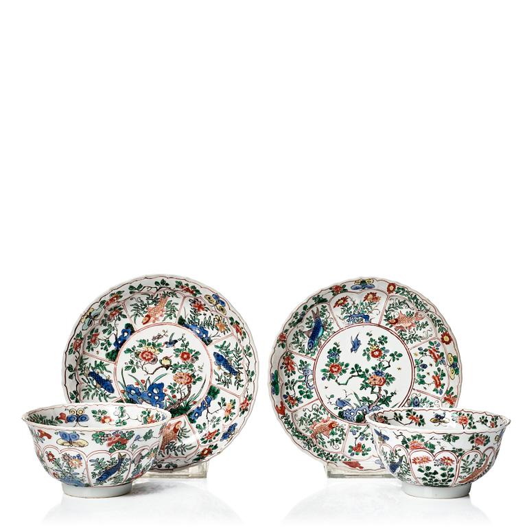 A pair of large famille verte cups with saucers, Qing dynasty, Kangxi (1662-1722).