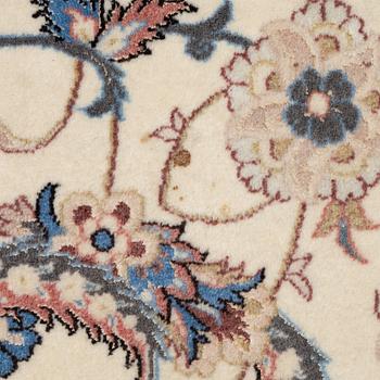 An Isfahan carpet, signed, approx. 372 x 255 cm.