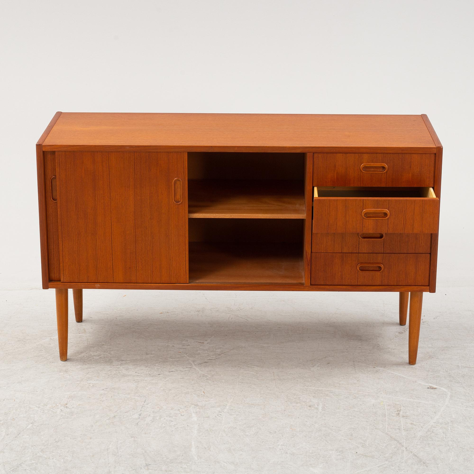 A 1950's teak veneered sideboard.