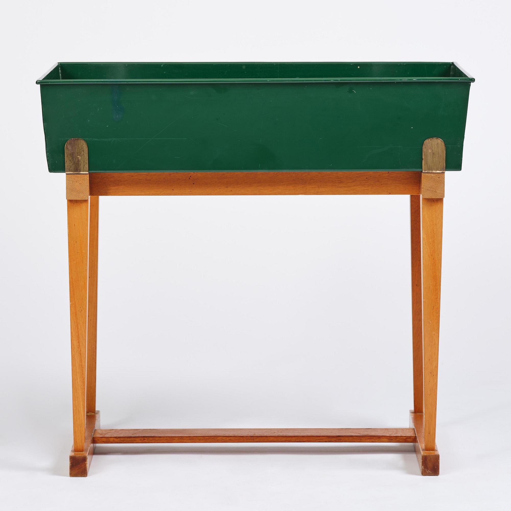 Josef Frank, a rare flower table with green lacquered box model B 2084, Firma Svenskt Tenn, 1950-60s.