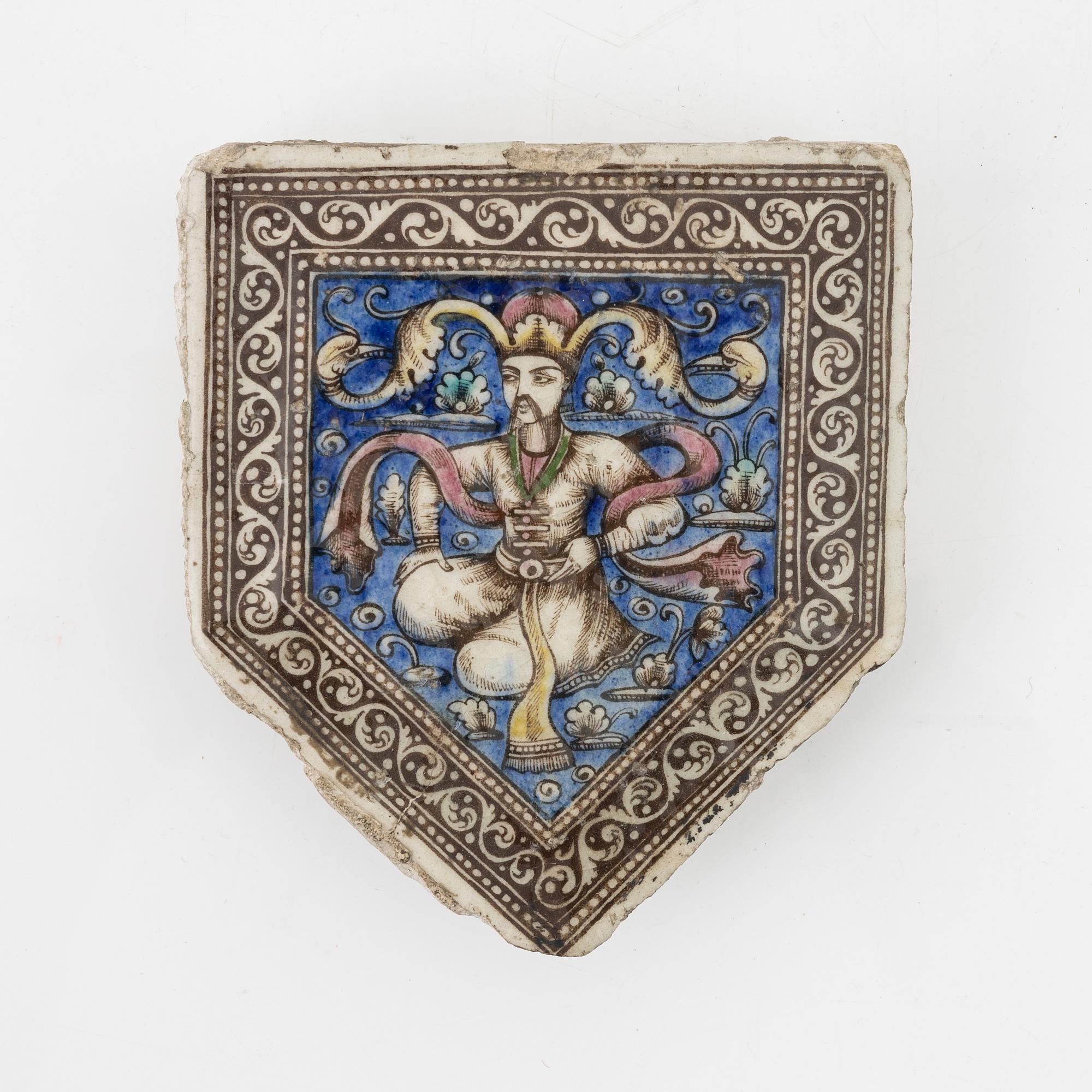 A Persian (Iranian) tile, glazed pottery, Qajar dynasty, 19th century.