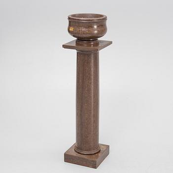 A limestone pedestal from around the year 1900.