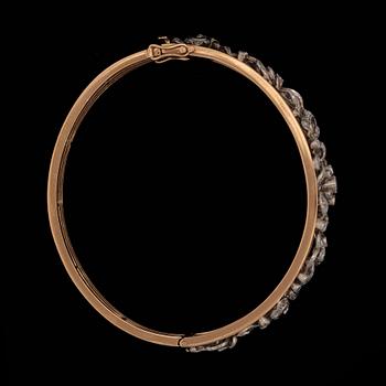 A brilliant- and rose cut diamond bangle.