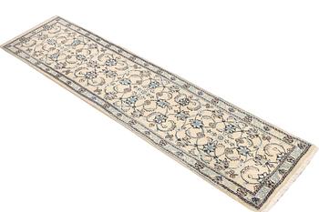 A Nain runner, part silk, c. 288 x 64 cm.
