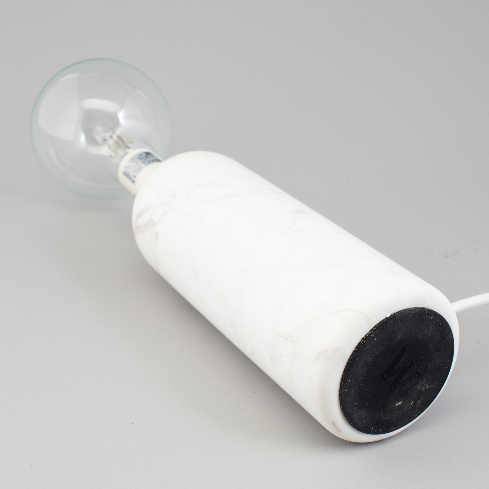 a "Kizu" table lamp by Lars Tornoe for New works.