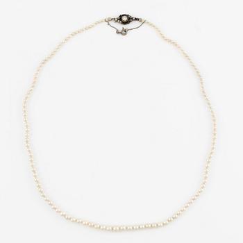 Pearl necklace with graduated cultured pearls, clasp in silver set with pastes, and a pair of pearl earrings,.