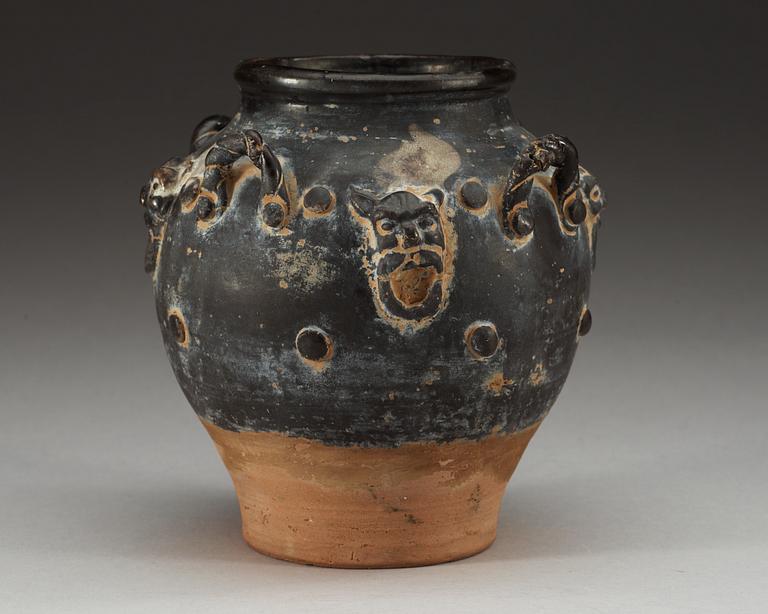 A black glazed jar, Tang dynasty (618-907).