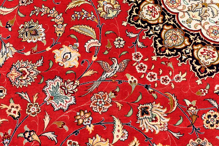 A carpet, Täbriz part silk, 341 x 248 cm.